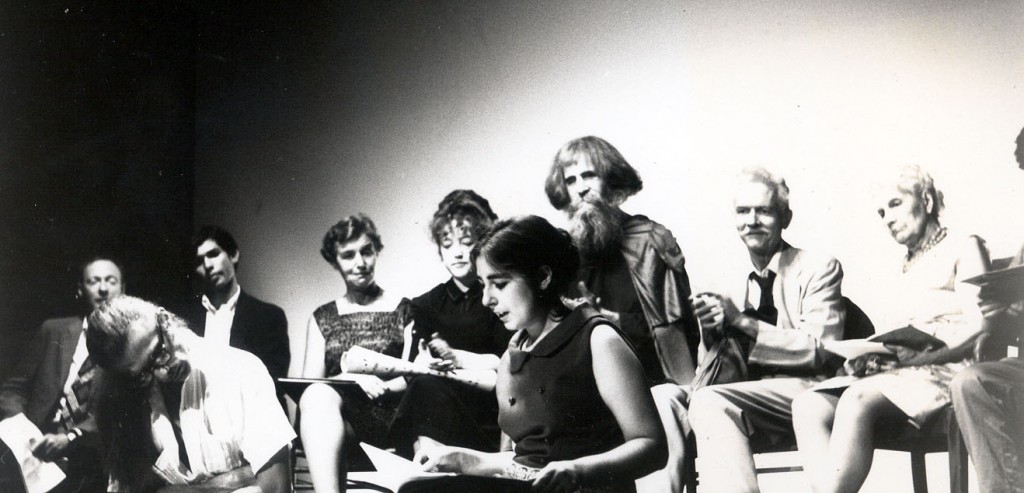 Poetry reading, 1966, at the 41st Street Theater in New York. Magie Dominic is in the foreground, seated on the floor. To her right, looking down,  is Peter Orlovsky. Behind her, with long hair and beard, is the blind poet-composer Moondog. Photo credit: James Gossage.